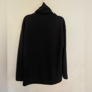Wide turtle neck pull over. Warn twice.